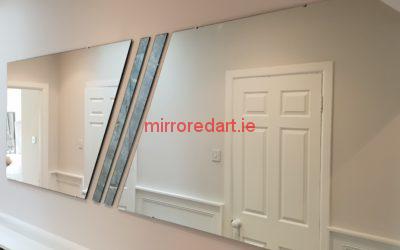 Mount Merrion Blackrock Co Dublin. A split angled mirror with two antique  mirrors in the middle covering a large area with a twist.