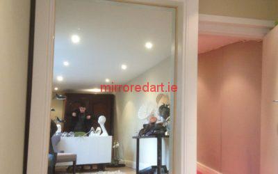 2.1 meter by 1.1 meter mirror in a white wood frame for a Milners shop in Fitzwilliam square Dublin.
