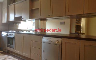 Silver mirrored splash back with cut outs for the electrical sockets for a house in Lusk North co Dublin.