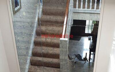 One of our Anitque mirrors in a frame on the turn of a stairs reflecting more light to the hall downstairs.