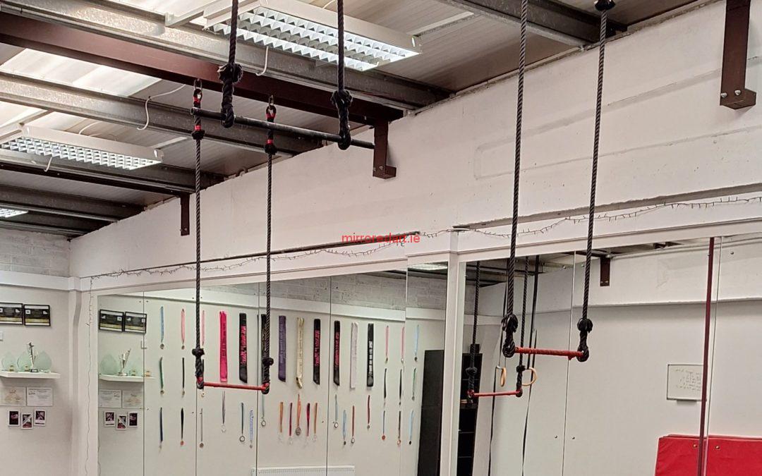 A large wall of mirror extending over 8 feet in height and 35 feet in width to capture students practicing trapeze and suspension exercises and routines for FierceFitness, Maynooth, Co. Kildare
