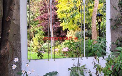 Three 2 metre high gothic mirrors in silver lead finish creating a window affect and beautiful reflection of garden